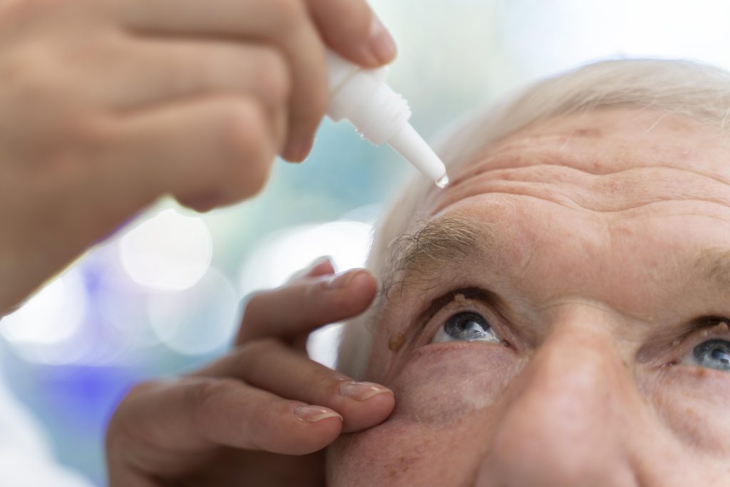 doctor pouring some eye drops patient 1024x683